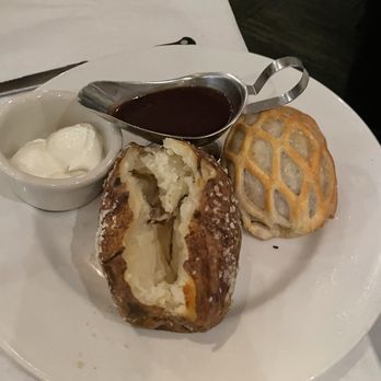 The River House - Beef Wellington with baked potato - Seafood Near Me - Palm Beach Gardens, Florida The River House - Beef Wellington with baked potato - Seafood Near Me - Palm Beach Gardens, Florida