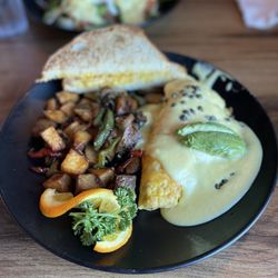 Pacific Omelet and Salmon Benedict. Yum! The potatoes are golden, the avocados are fresh.