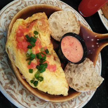 Another Broken Egg Cafe - Mardi Gras omelette with hollandaise sauce - Breakfast & Brunch Near Me - New Orleans, Louisiana Another Broken Egg Cafe - Mardi Gras omelette with hollandaise sauce - Breakfast & Brunch Near Me - New Orleans, Louisiana