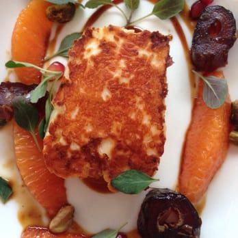 Zaytinya - Seared Halloumi cheese with Medjool dates, orange suprémes, pistachios, and oregano - Greek Near Me - Washington, DC, District of Columbia Zaytinya - Seared Halloumi cheese with Medjool dates, orange suprémes, pistachios, and oregano - Greek Near Me - Washington, DC, District of Columbia