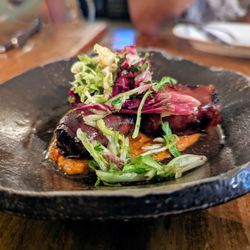 Mateo - Datiles. $10. Goat cheese stuffed dates, crispy serrano ham, romesco.