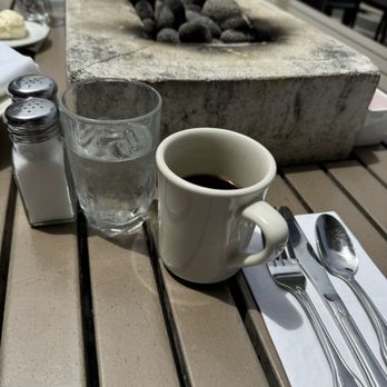 Dorn's Original Breakers Cafe - Interesting briquet fire pit in center of outdoor tables. - Seafood Near Me - Morro Bay, California