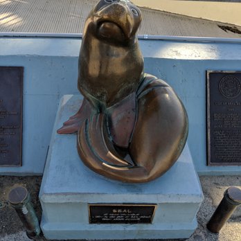 Seal Beach Pier - Cute seal statue at the beginning of the pier. - Local Flavor Near Me - Seal Beach, California