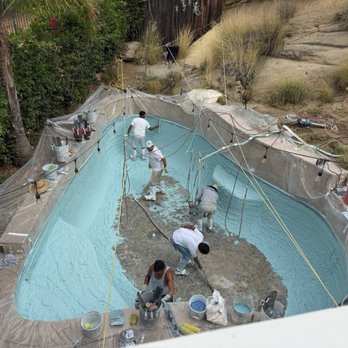 Stanton Pools - Application of Stonescape pebble finish. - Pool & Hot Tub Service Near Me Stanton Pools - Application of Stonescape pebble finish. - Pool & Hot Tub Service Near Me