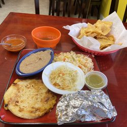 Restaurante Y Pupuseria Dora - Cheese pupusa, pastor taco, beans, and rice with complimentary chips and salsa