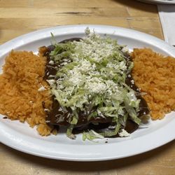 Chicken enchiladas with Mole sauce and rice