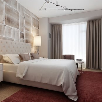 NVI Home Improvement - a bedroom with a bed, dressers, and a flat screen tv - General Contractors Near Me - Brooklyn, New York NVI Home Improvement - a bedroom with a bed, dressers, and a flat screen tv - General Contractors Near Me - Brooklyn, New York