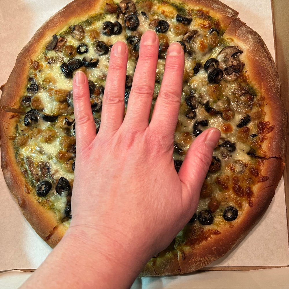I don't have particularly large hands. This is their $25 medium pizza.