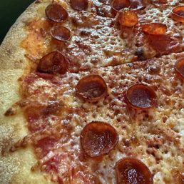 Cheese pizza with pepperoni added. Cheese pizza with pepperoni added.