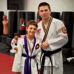 World Class Martial Arts - Master Kane and our little senior purple belt