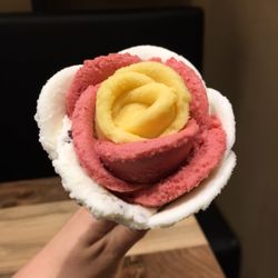 Amorino - Passionfruit sorbet, strawberry sorbet, and straciatella gelato in a regular cone