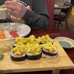 Sushi lunch in the background, Crazy Mango Roll in the foreground. Sushi lunch in the background, Crazy Mango Roll in the foreground.