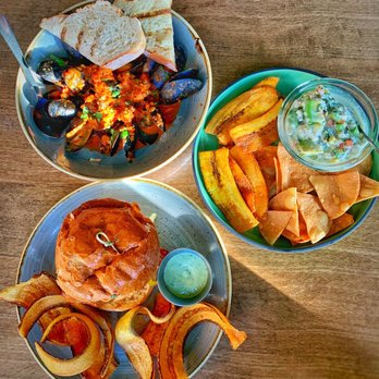 Havana - two plates of food on a wooden table - Latin American Near Me - Vancouver, British Columbia