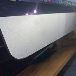 Best Buy - Tried to touch it up with a marker, but the damage is still pretty obvious. Bottom Left Corner