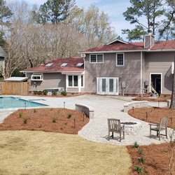Crescent Moon Landscaping - Pool patio and outdoor living space accented with a beautiful lawn and plantings.