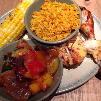 Nando's Peri-Peri - Chicken with Portuguese rice, corn ok cob and grilled veggies - Chicken Shop Near Me - Chicago, Illinois Nando's Peri-Peri - Chicken with Portuguese rice, corn ok cob and grilled veggies - Chicken Shop Near Me - Chicago, Illinois