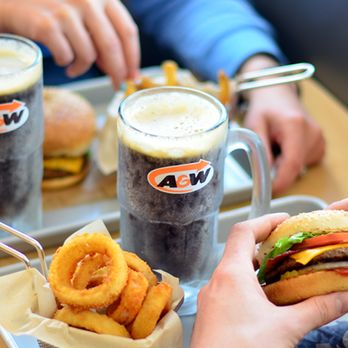 A&W - a person eating a hamburger and onion rings - Fast Food Near Me - Red Deer, Alberta