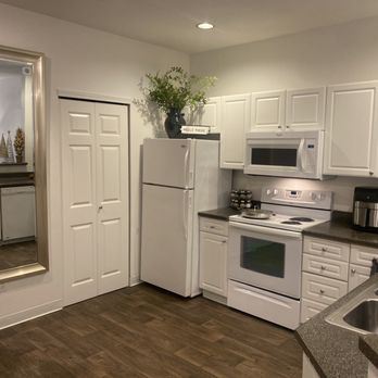 Summerwalk at Klahanie - Laundry room closet off of kitchen - Apartments Near Me - Issaquah, Washington Summerwalk at Klahanie - Laundry room closet off of kitchen - Apartments Near Me - Issaquah, Washington
