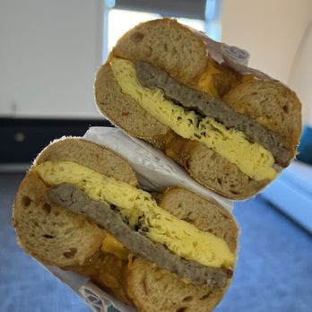 Otherside Bagel Co. - a person holding a sandwich - Bagels Near Me - Bellingham, Washington Otherside Bagel Co. - a person holding a sandwich - Bagels Near Me - Bellingham, Washington