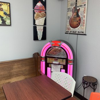 Mad Mike's Ice Cream - Table and jukebox - Ice Cream & Frozen Yogurt Near Me - Pantego, Texas Mad Mike's Ice Cream - Table and jukebox - Ice Cream & Frozen Yogurt Near Me - Pantego, Texas