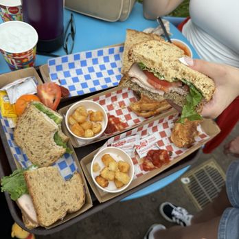 Woody's Lunch Box - Turkey sandwich and brisket sandwich meals with tater tots and cuties - Sandwiches Near Me - Lake Buena Vista, Florida Woody's Lunch Box - Turkey sandwich and brisket sandwich meals with tater tots and cuties - Sandwiches Near Me - Lake Buena Vista, Florida