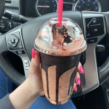 Perky Pony Coffee - a hand holding a chocolate milkshake - Coffee & Tea Near Me - Lebanon, Oregon
