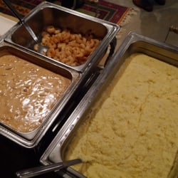 Palmetto Ridge - Shrimp 'n Grits with a tomato sausage gravy