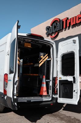 SDG&E van upfit - Project Overview
When SDG&E needed a scalable organization solution for their service fleet, the goal was clear: maximize efficiency, improve safety, and create a standardized layout across multiple utility vans.
SoCal Truck partnered with SDG&E’s fleet management team to design and install a fully integrated van organization system built for daily field operations. These vans carry specialized tools, electrical components, testing equipment, and safety gear all of which must be secure, accessible, and durable.
Custom Shelving Systems
We installed commercial-grade modular shelving designed to support heavy tools and utility equipment while maintaining a clean, organized layout. Adjustable shelving allows flexibility for evolving inventory needs.
Steel Partitions & Bulkheads
Each van was outfitted with a reinforced partition system to protect drivers from shifting cargo while improving cabin comfort and reducing road noise.
Ladder Racks & Exterior Storage
Heavy-duty roof rack systems were installed to safely transport ladders and long materials without compromising interior cargo space.
Standardized Fleet Layout
Consistency across vehicles was critical. We developed a repeatable configuration so technicians can move between vans without disruption — reducing downtime and increasing productivity.
Professional Installation & Quality Control
All components were professionally installed to manufacturer specifications, ensuring long-term durability under demanding field conditions. SDG&E van upfit - Project Overview
When SDG&E needed a scalable organization solution for their service fleet, the goal was clear: maximize efficiency, improve safety, and create a standardized layout across multiple utility vans.
SoCal Truck partnered with SDG&E’s fleet management team to design and install a fully integrated van organization system built for daily field operations. These vans carry specialized tools, electrical components, testing equipment, and safety gear all of which must be secure, accessible, and durable.
Custom Shelving Systems
We installed commercial-grade modular shelving designed to support heavy tools and utility equipment while maintaining a clean, organized layout. Adjustable shelving allows flexibility for evolving inventory needs.
Steel Partitions & Bulkheads
Each van was outfitted with a reinforced partition system to protect drivers from shifting cargo while improving cabin comfort and reducing road noise.
Ladder Racks & Exterior Storage
Heavy-duty roof rack systems were installed to safely transport ladders and long materials without compromising interior cargo space.
Standardized Fleet Layout
Consistency across vehicles was critical. We developed a repeatable configuration so technicians can move between vans without disruption — reducing downtime and increasing productivity.
Professional Installation & Quality Control
All components were professionally installed to manufacturer specifications, ensuring long-term durability under demanding field conditions.