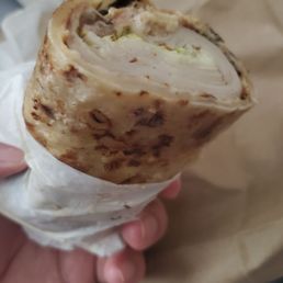 Turkey wrap with provolone and jalapeños.