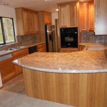 Gallion Granite and Tile - a kitchen with wood cabinets - General Contractors Near Me - Modesto, California Gallion Granite and Tile - a kitchen with wood cabinets - General Contractors Near Me - Modesto, California