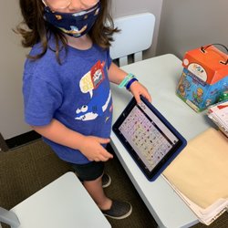 Orange County Speech Services - Learning the new AAC device in speech therapy.