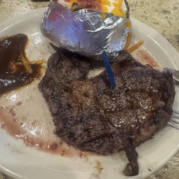 Logan's Roadhouse - 12 oz. Signature Ribeye Loaded Baked Potato - Steakhouses Near Me - Laredo, Texas