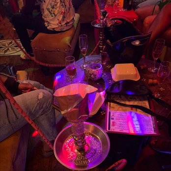 Kazuza - a group of people sitting around a table - Hookah Bars Near Me - New York, New York Kazuza - a group of people sitting around a table - Hookah Bars Near Me - New York, New York