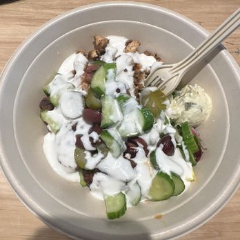 CAVA - Rice salad pickles olives garlic dressing and chicken yum - Salad Near Me - Orlando, Florida