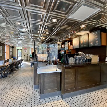 Starbucks - the interior of a coffee shop - Coffee & Tea Near Me - Montreal, Quebec Starbucks - the interior of a coffee shop - Coffee & Tea Near Me - Montreal, Quebec