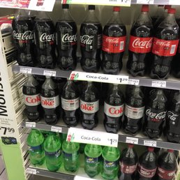 a display of coca colas in a grocery store a display of coca colas in a grocery store