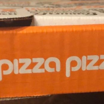 Pizza Pizza - a person holding a box of pizza - Pizza Near Me - Brampton, Ontario Pizza Pizza - a person holding a box of pizza - Pizza Near Me - Brampton, Ontario