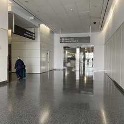 Global Entry Office - After the walkway, right turn past then left past the elevators, then you will make another right turn, then see the office.