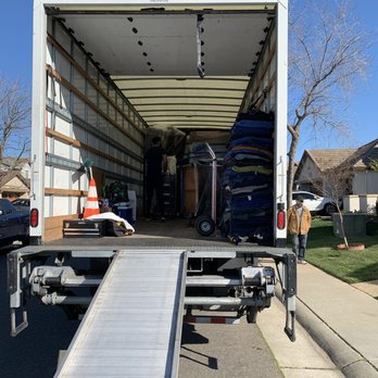Good Movers - Strapping in layers in the truck. - Movers Near Me