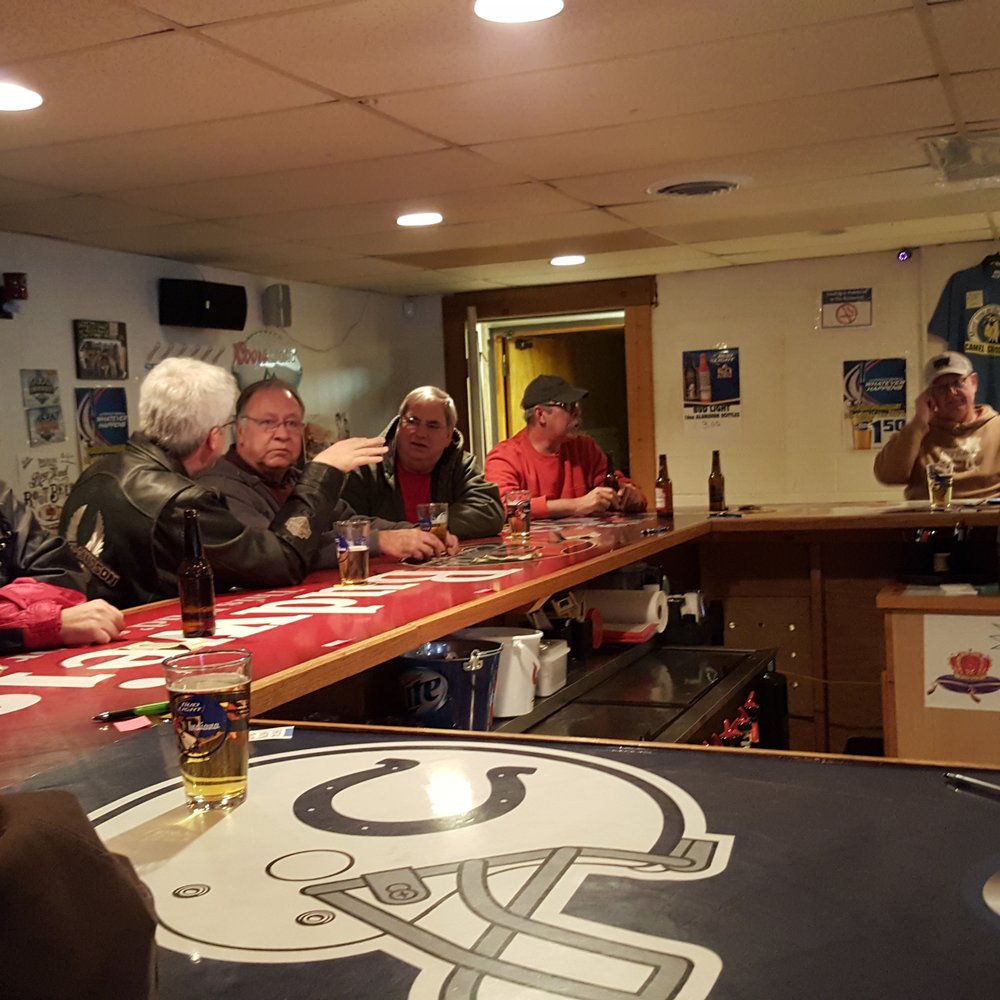Camel Crossing - a group of people sitting at a bar - Pizza Near Me - Lafayette, Indiana