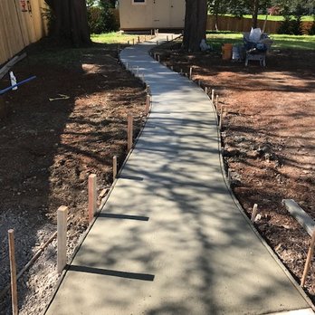 ST Concrete - 3' curved walkway to shed; gorgeous aggregate stone underneath comes through after perfect timing and special wipe/wash away of cement. - Masonry/Concrete Near Me ST Concrete - 3' curved walkway to shed; gorgeous aggregate stone underneath comes through after perfect timing and special wipe/wash away of cement. - Masonry/Concrete Near Me