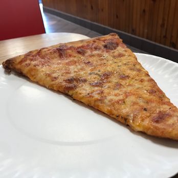 Caln Pizza & Pasta - a slice of pizza on a paper plate - Pizza Near Me - Downingtown, Pennsylvania Caln Pizza & Pasta - a slice of pizza on a paper plate - Pizza Near Me - Downingtown, Pennsylvania