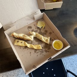 Small bread sticks and tiny dip Small bread sticks and tiny dip