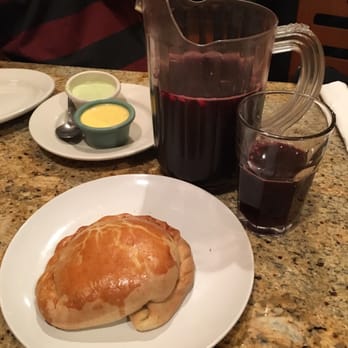 Machu Chicken - The empanada, the two complimentary sauces, and the purple corn drink. All delicious. - Peruvian Near Me - Somerville, Massachusetts Machu Chicken - The empanada, the two complimentary sauces, and the purple corn drink. All delicious. - Peruvian Near Me - Somerville, Massachusetts
