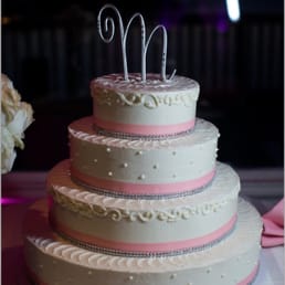 White sponge cake with buttercream frosting on the outside and raspberry mousse on the inside. Amazing! White sponge cake with buttercream frosting on the outside and raspberry mousse on the inside. Amazing!