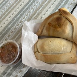 Baked empanadas: beef on bottom, chicken on top $3.50 each
