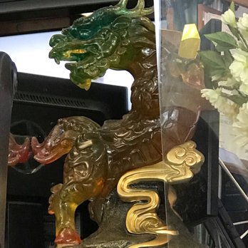 Sichuan Taste - a statue of a dragon and a dragon - like animal - Chinese Near Me - Cockeysville, Maryland Sichuan Taste - a statue of a dragon and a dragon - like animal - Chinese Near Me - Cockeysville, Maryland