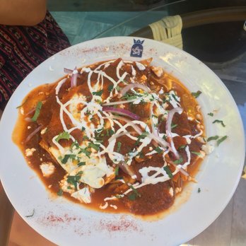North Garden - Chilaquiles topped with 2 fried eggs in salsa roja - Signature Cuisine Near Me - Cancún, ROO North Garden - Chilaquiles topped with 2 fried eggs in salsa roja - Signature Cuisine Near Me - Cancún, ROO