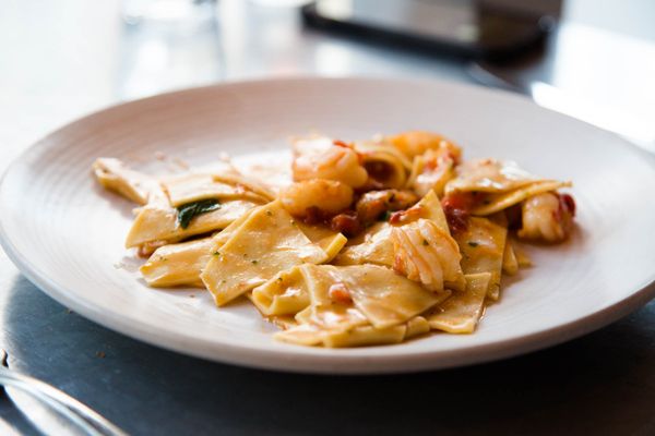 Photo of Delfina - San Francisco, CA, US. triangle sheet pasta with shrimp. they've always got at least one type of pasta on the menu that i've never heard of