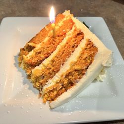 Four Roses Cafe - Carrot cake, with a candle for my wife's birthday